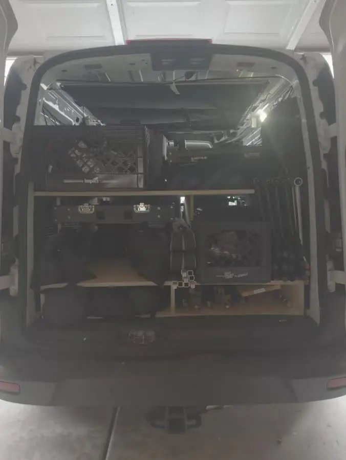 The rear of RCK’s equipment van with production carts, stands, and cases
